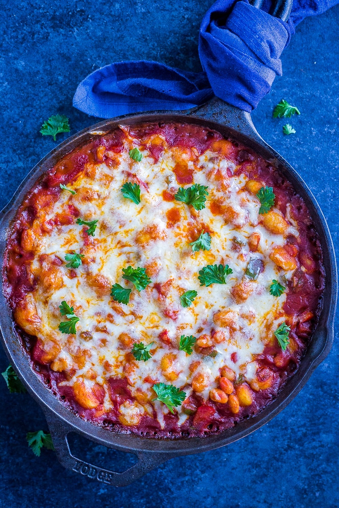 30 Minute Gnocchi Pizza Bake with White Beans on a black background