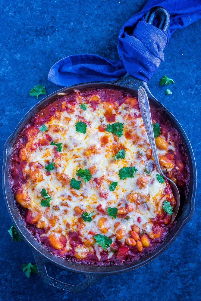 30 Minute Gnocchi Pizza Bake with White Beans in a pan with a spoon in it
