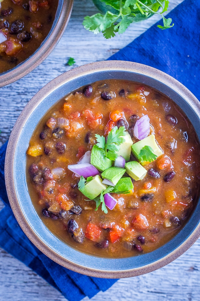 Bowl of Butternut Squash Chili with Black Beans with toppings