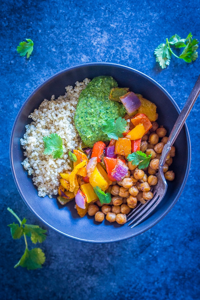 Chickpea Fajita Meal Prep Bowls in a black bowl with a fork