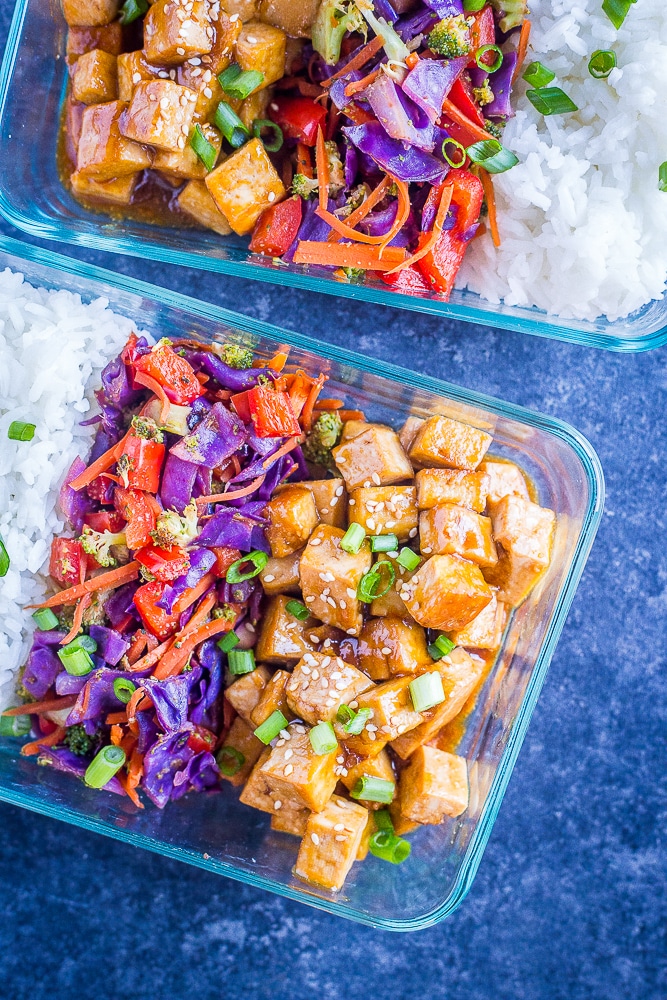 Sesame Ginger Tofu Meal Prep Bowls on a black background