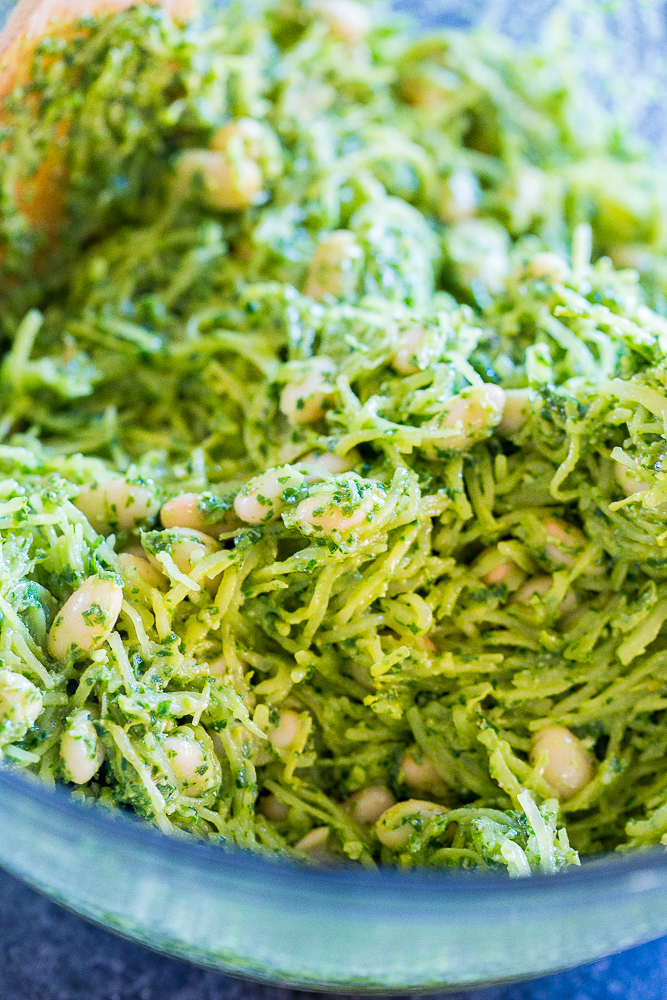 Bowl of spaghetti squash with pesto and white beans for Spaghetti Squash Melts with Pesto and White Beans