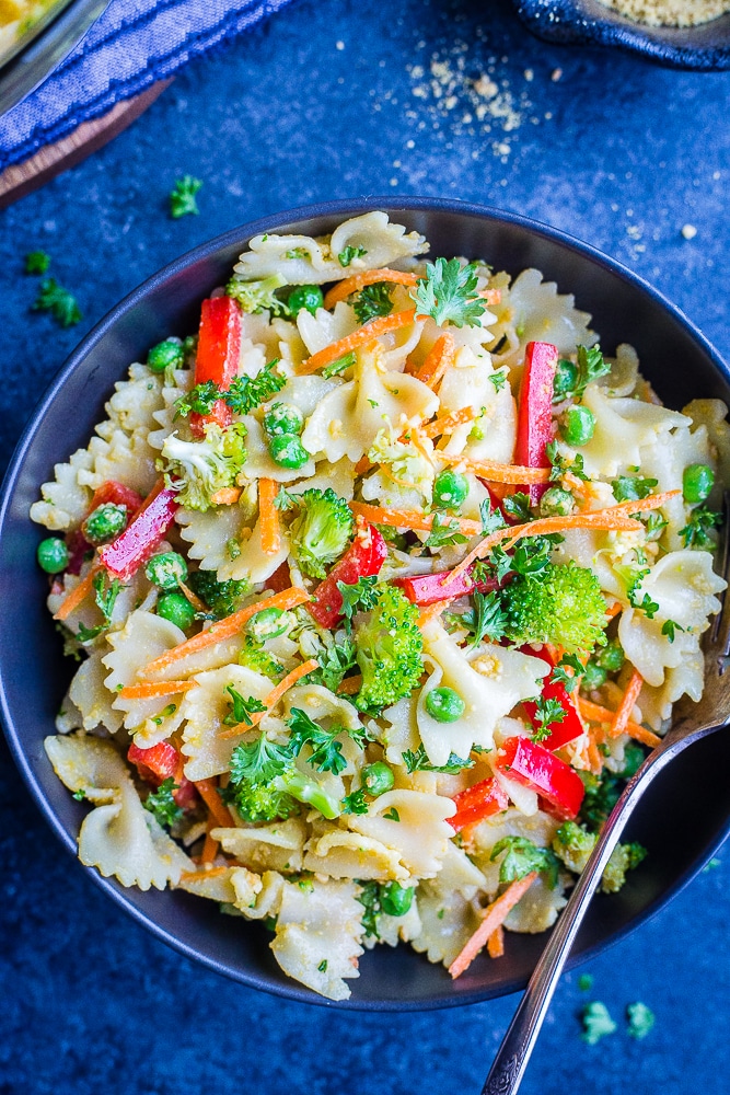 Bowl of Vegan Primavera Pasta Salad on a black background