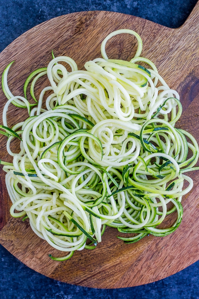 Noodles on a cutting board for the Avocado Pesto Zucchini Noodle Recipe