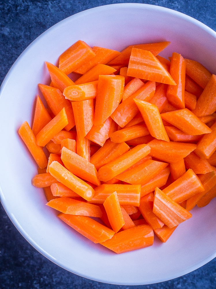 A bowl of cut up carrots for this Ranch Roasted Carrot Recipe