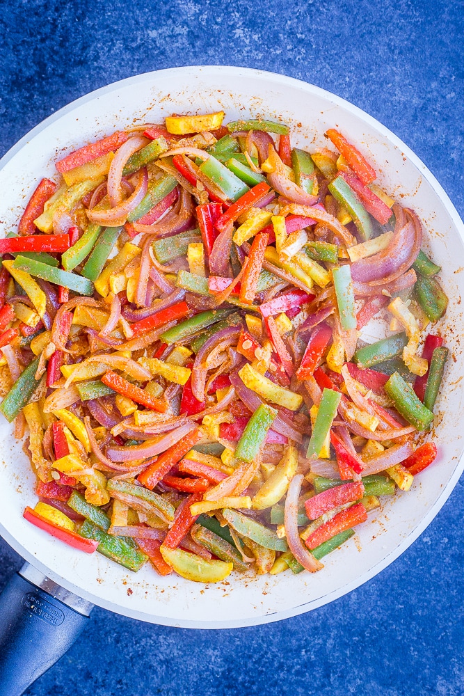 Cooked vegetables in a pan for fajita tostadas