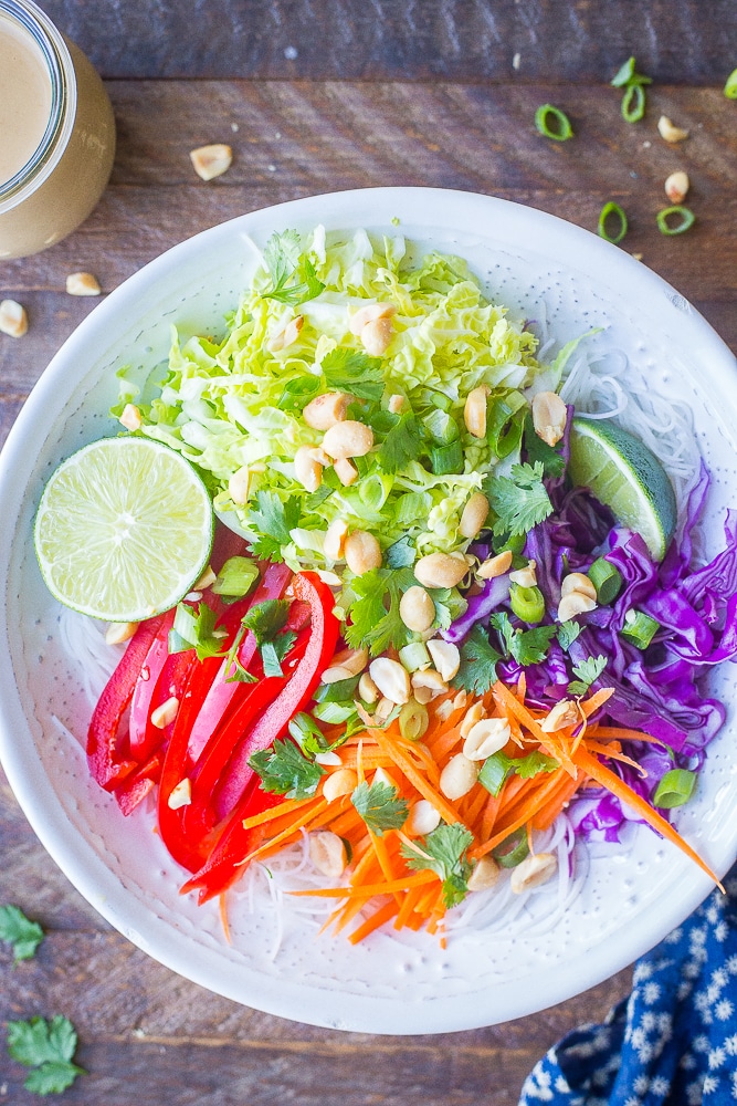 Bowl of Thai Peanut Noodle Bowls on a wooden background