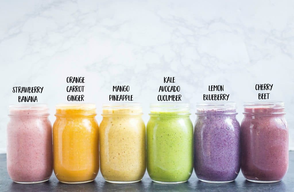 Healthy Smoothie Recipes lined up in mason jars