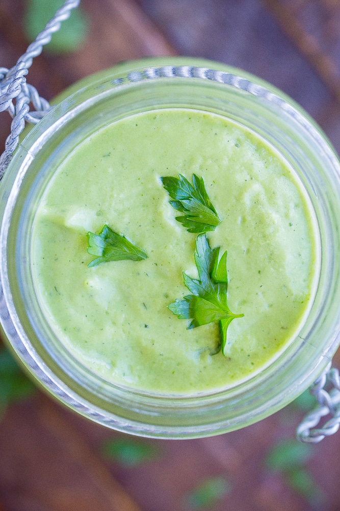 Close up view of avocado ranch dressing in a jar