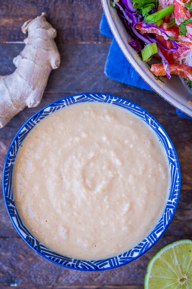 Bowl of best homemade peanut sauce with ginger, lime and noodle salad