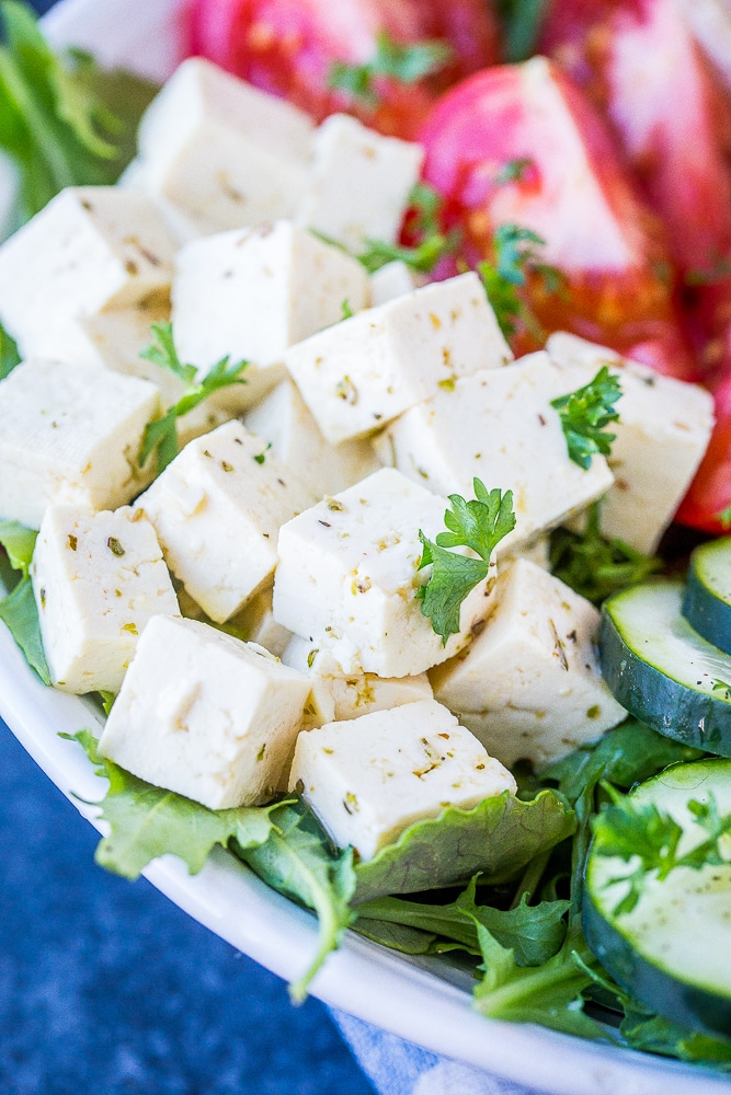 Close up of vegan feta cheese on a salad