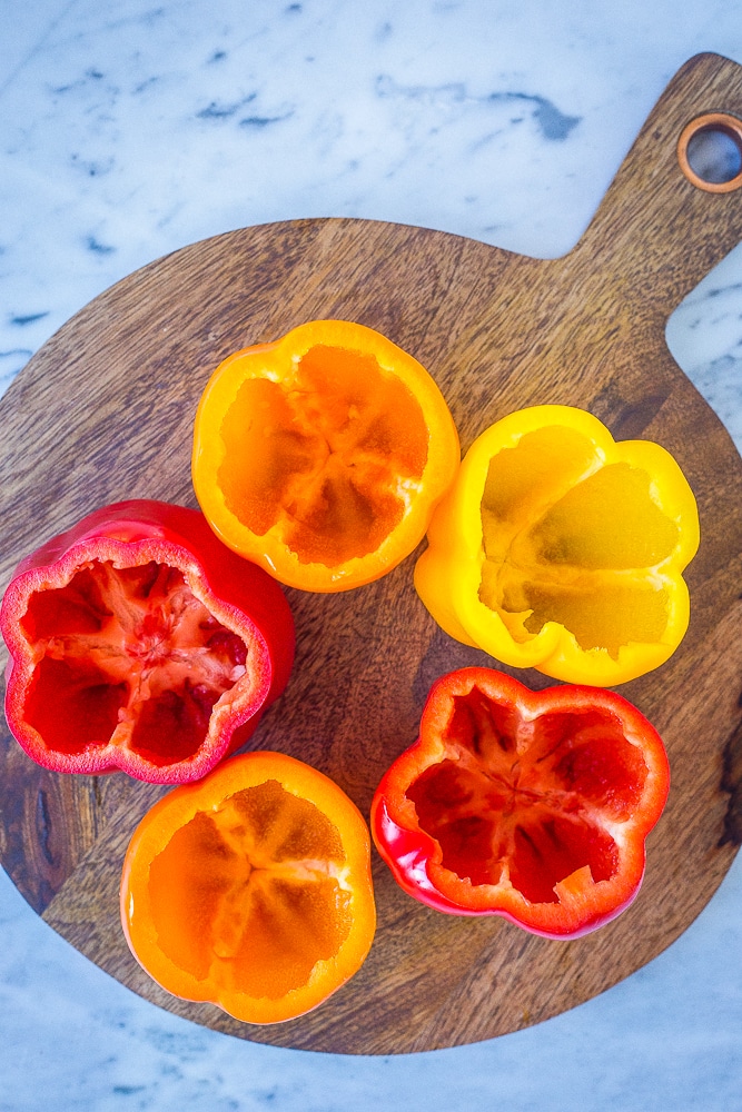 Bell peppers cut open for vegetarian stuffed pepper recipe