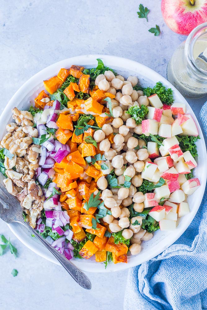 bowl of fall harvest salad with maple tahini dressing