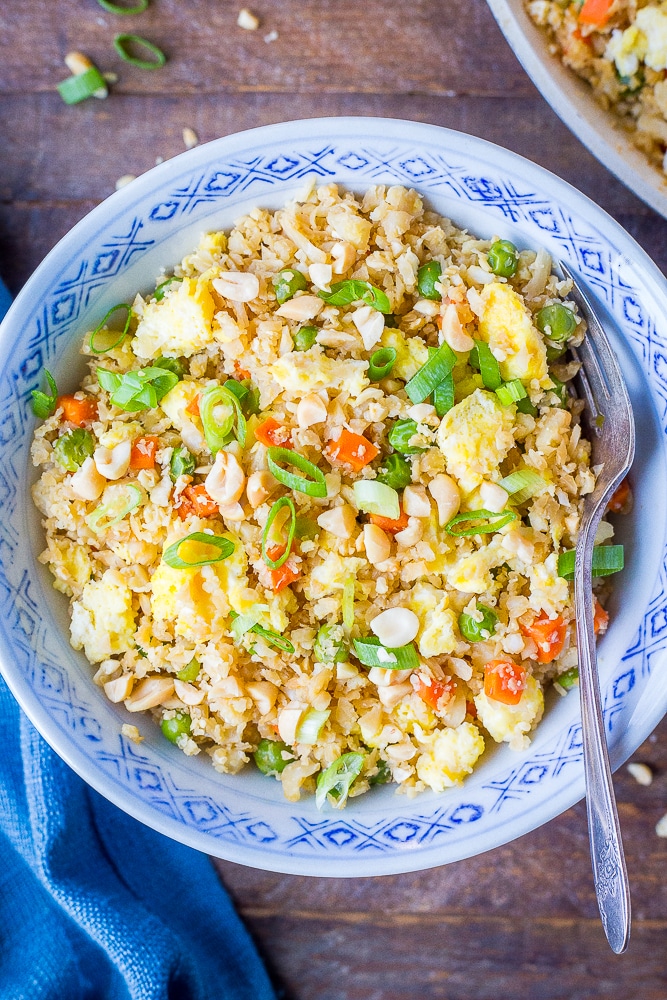 Cauliflower Fried Rice recipe in a bowl with a fork