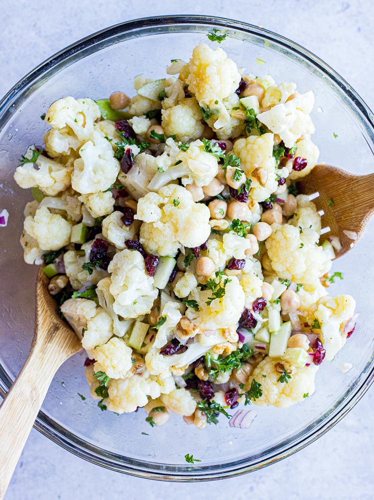 curried cauliflower salad all mixed up in a bowl
