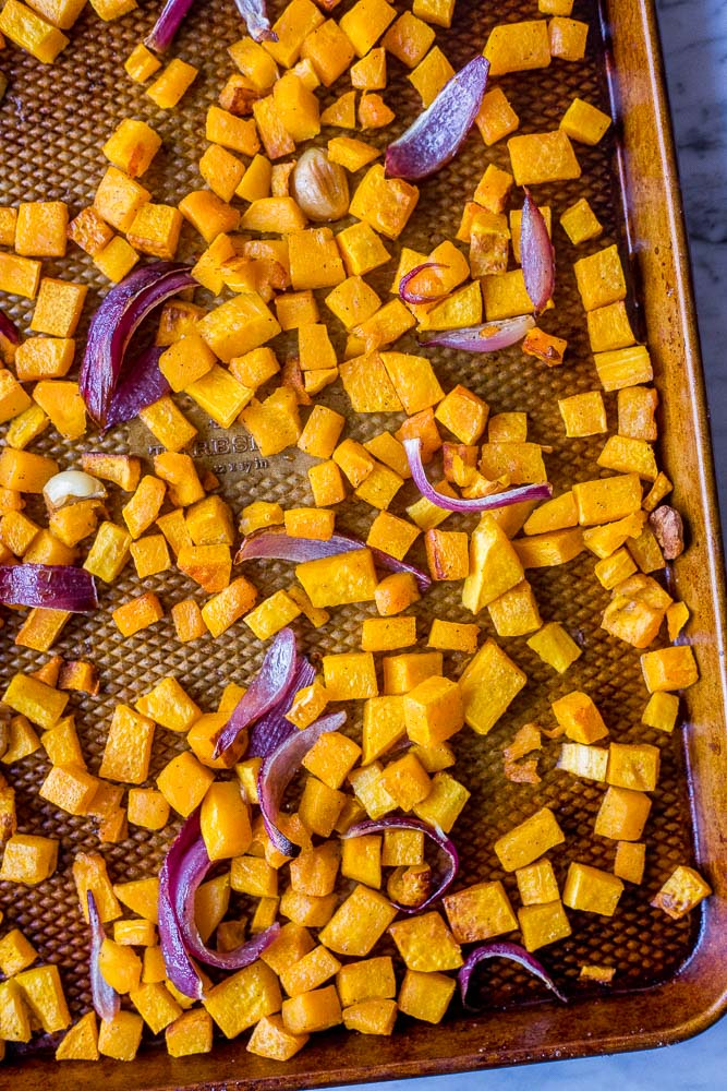 Tray of roasted butternut squash showing how to make roasted butternut squash soup