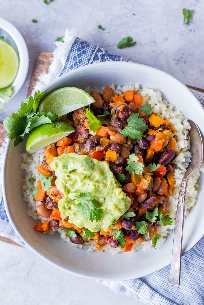 Bowl of Chili Beans with guacamole and cilantro