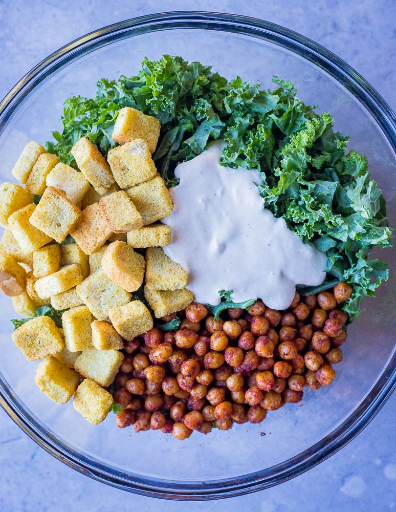 A big bowl of ingredients for these kale Caesar salad pitas