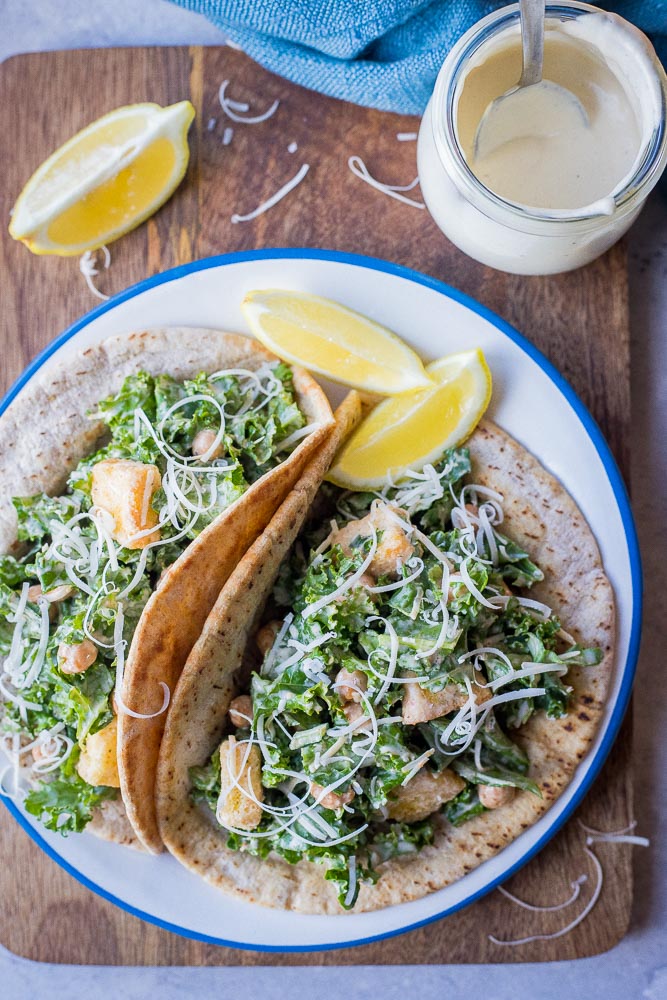 Flat lay photos of a plate of two pita sandwiches