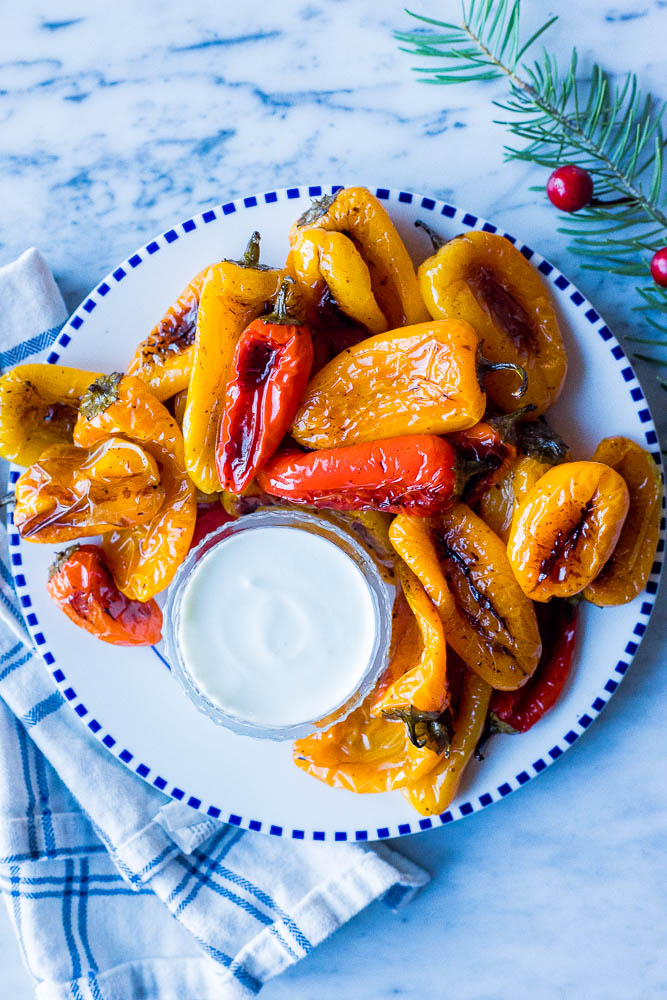 A plate of roasted sweet peppers with goat cheese dip