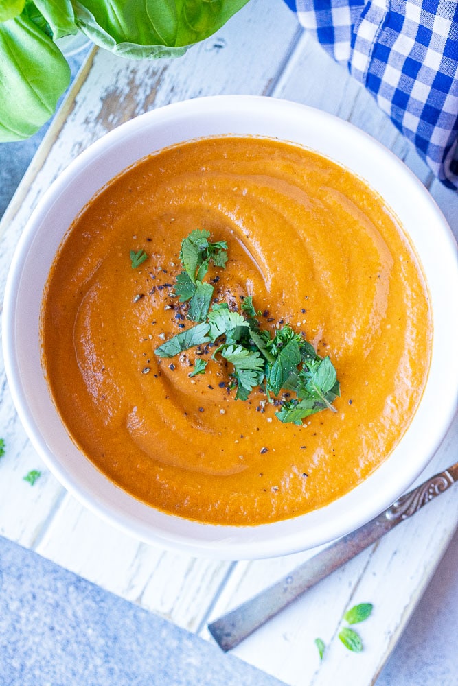 Bowl of Roasted Tomato Soup topped with Fresh herbs