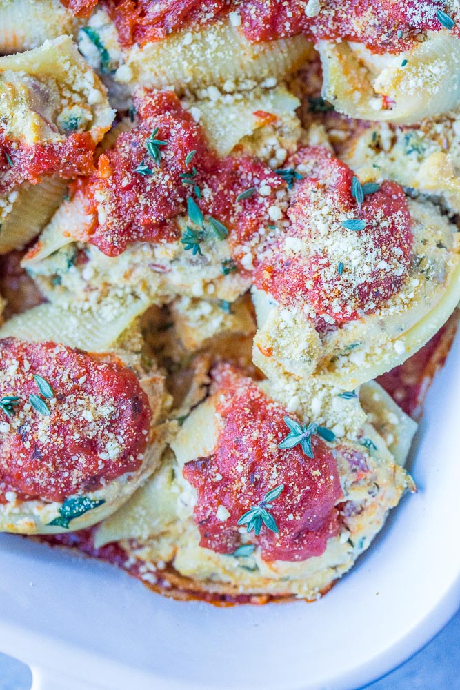 Close up of vegan stuffed shells in a baking dish