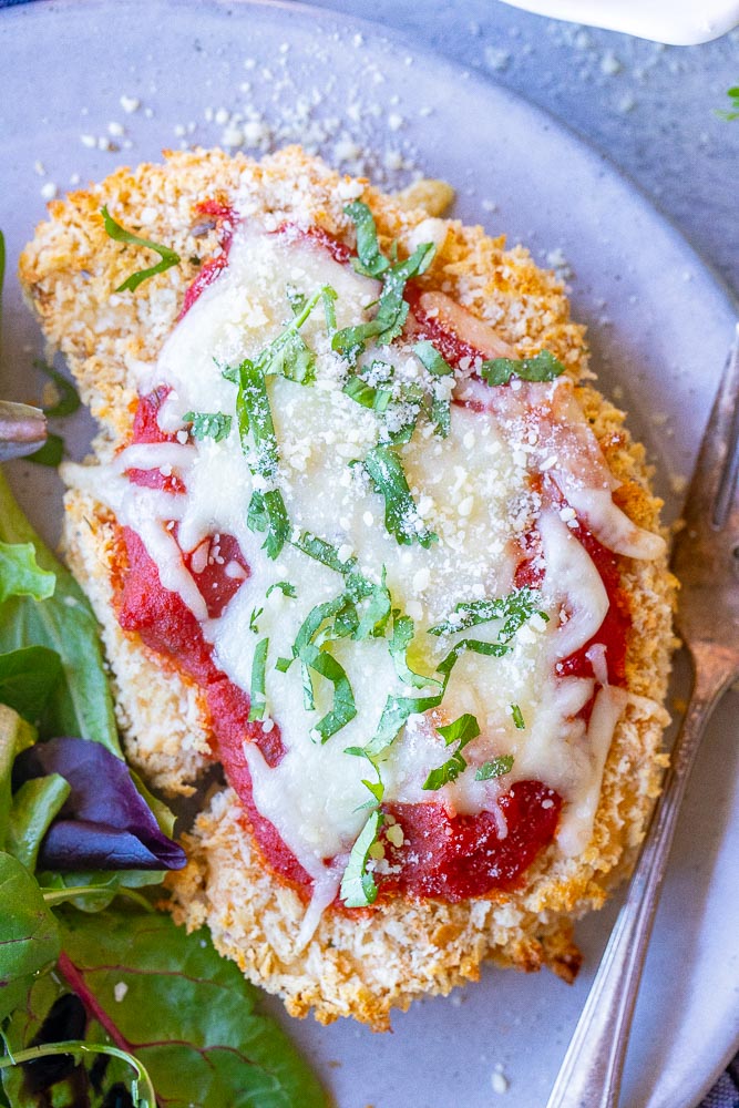 a plate with a slice of cauliflower parmesan