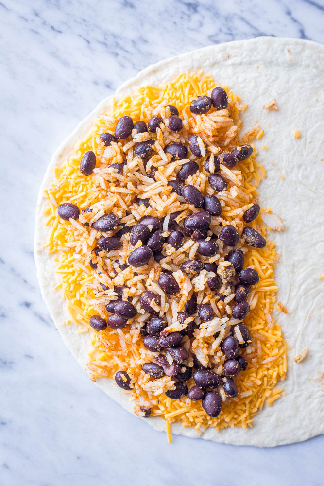 A tortilla with cheese and rice and beans for these rice and bean quesadillas