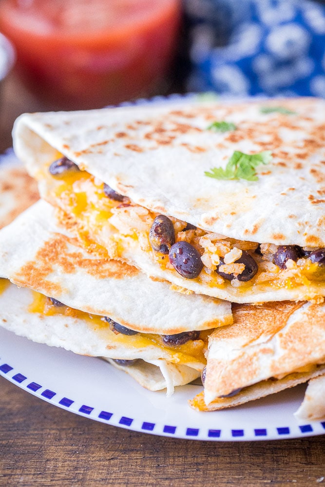 A stack of rice and bean quesadillas on a plate