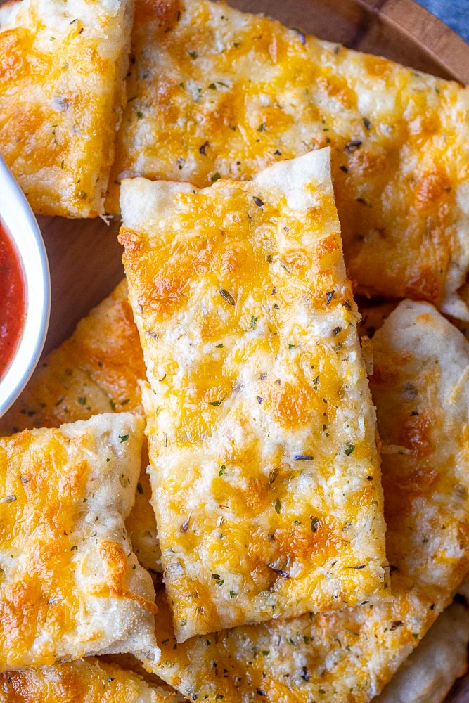 Close up of a plate of garlic cheese bread