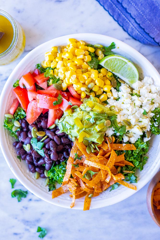 Mexican Kale Salad in a bowl with lots of toppings