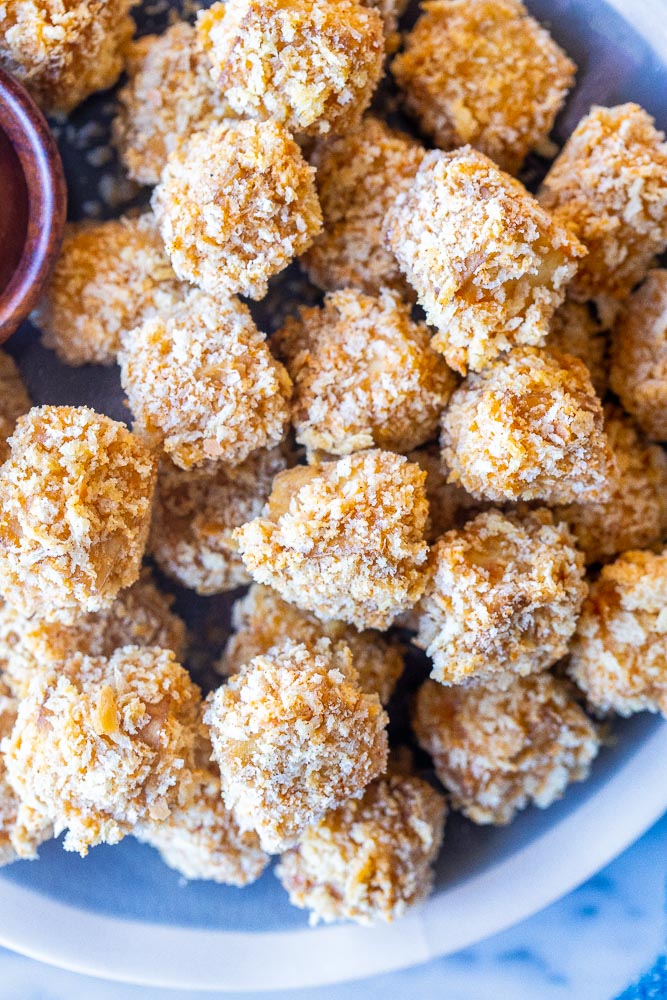 Close up of a plate of crispy tofu nuggets