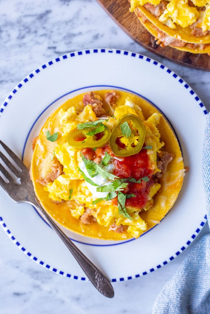 Huevos Rancheros recipe on a plate with a fork