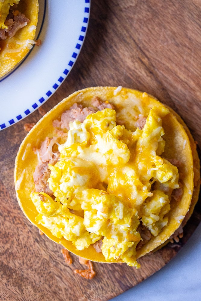 Huevos rancheros on a cutting board out of the oven