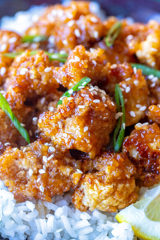 Close up photo of a piece of sticky lemon cauliflower