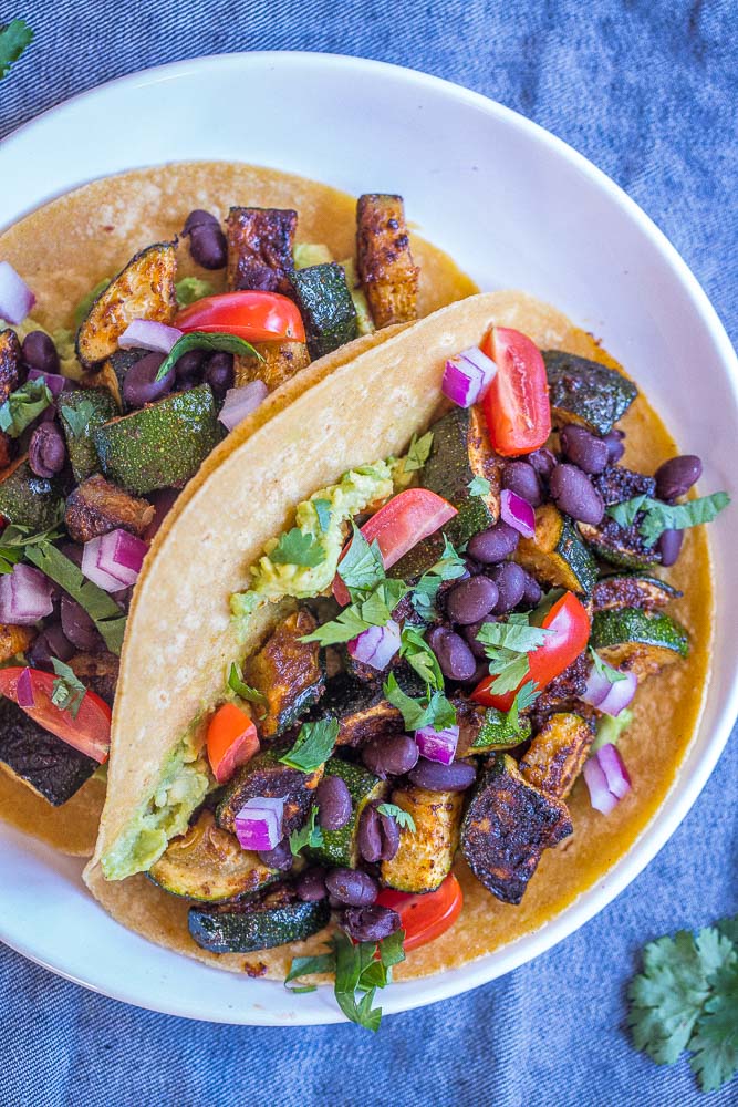 Close up of blackened zucchini tacos on a plate