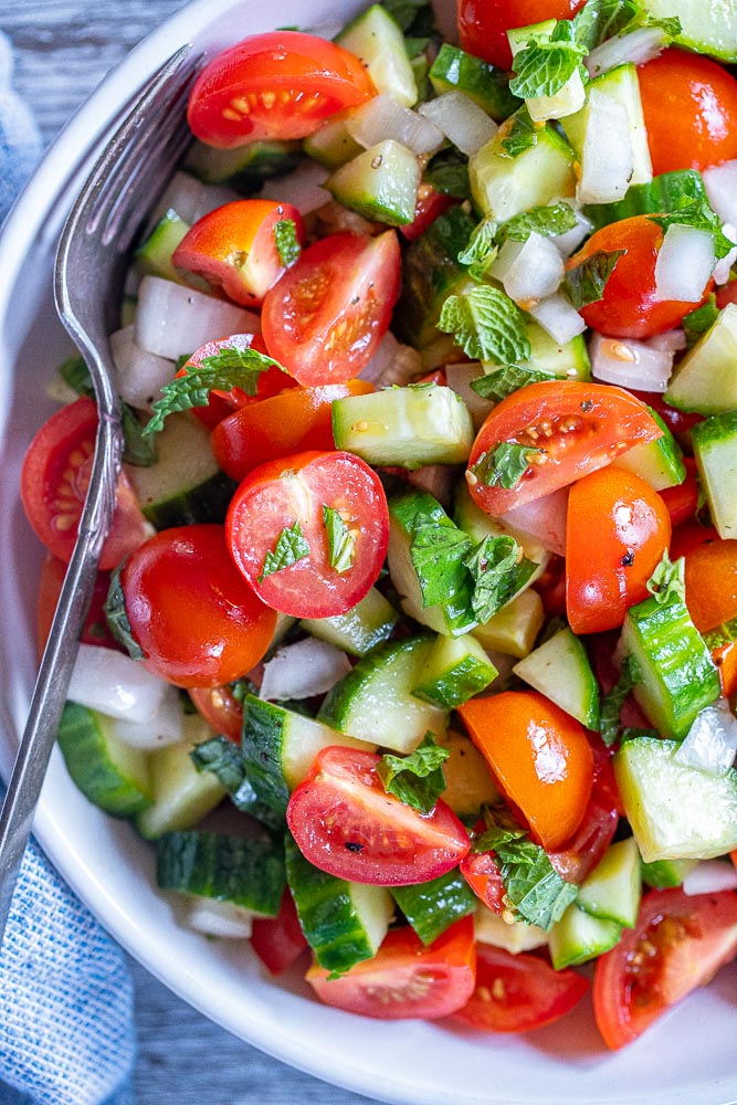 close up of a bowl of tomato salad