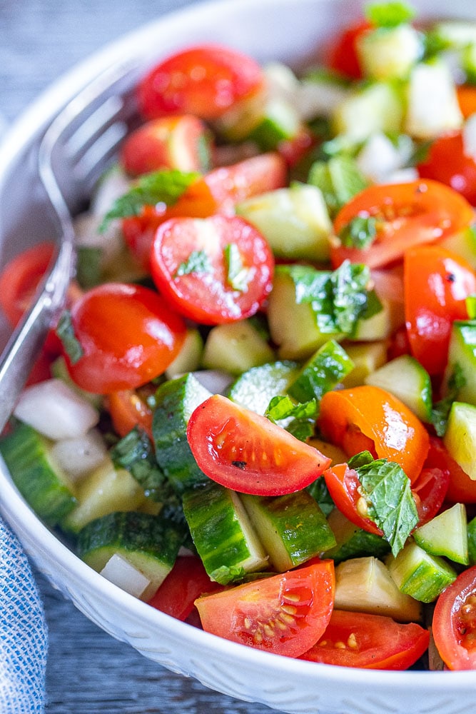 close up of a bowl of cucumber salad