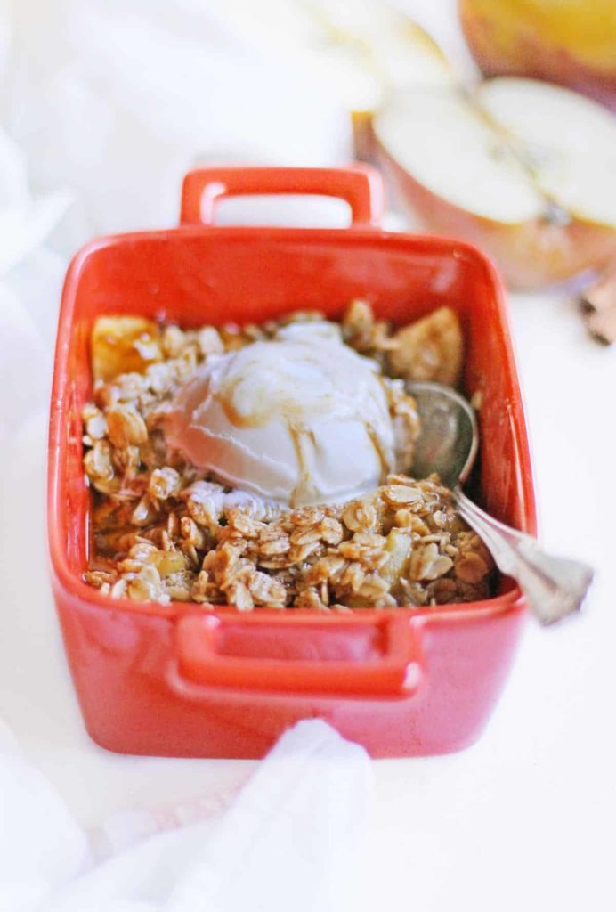 A plastic container filled with food, with Apple crisp