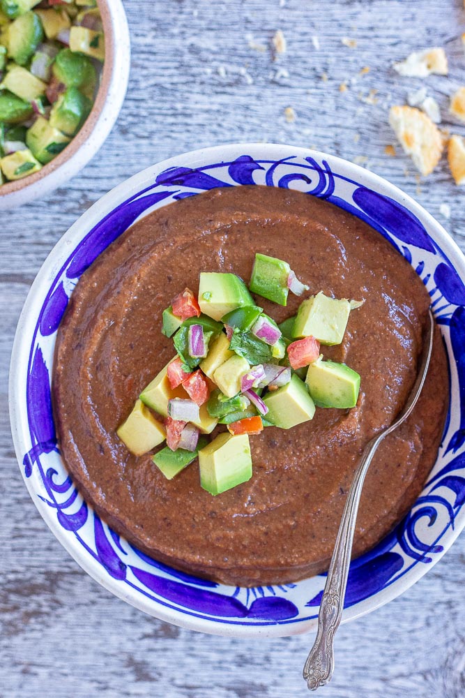 close up of a bowl of black bean soup