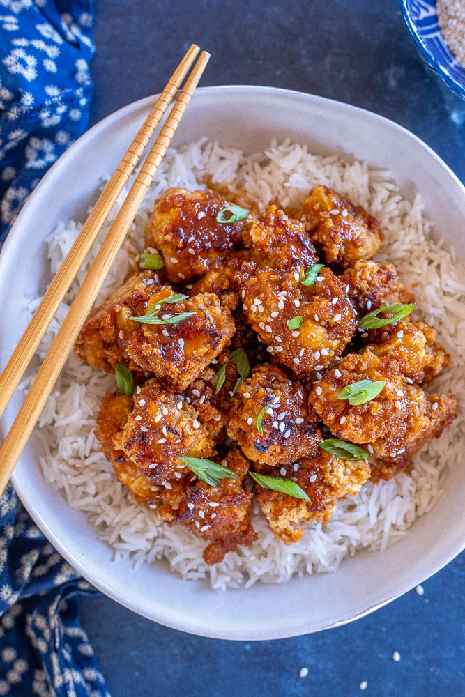 Large bowl of crispy teriyaki cauliflower over rice