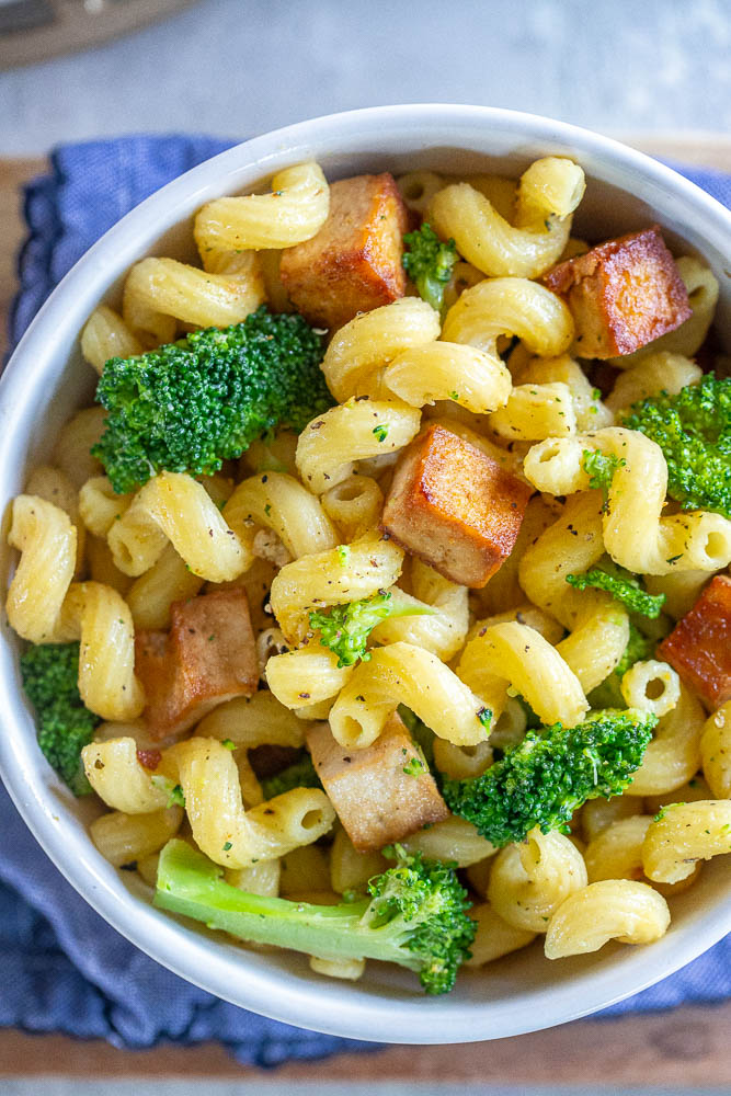 close up of a bowl of tofu broccoli pasta recipe