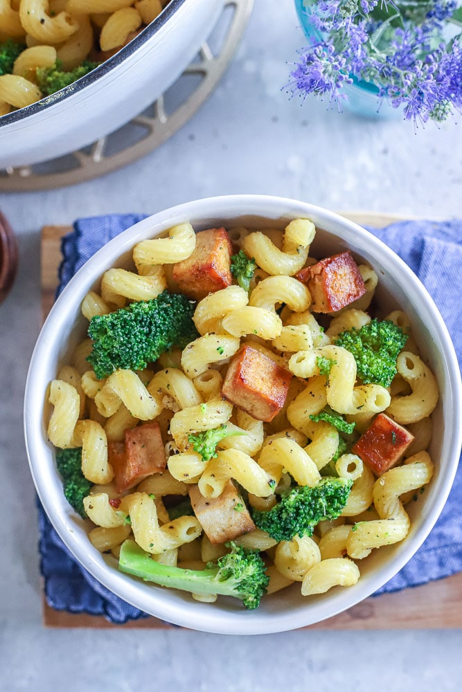 Tofu broccoli pasta in a bowl on a table