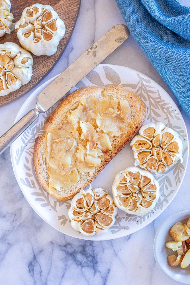 Roasted garlic spread on a piece of toast