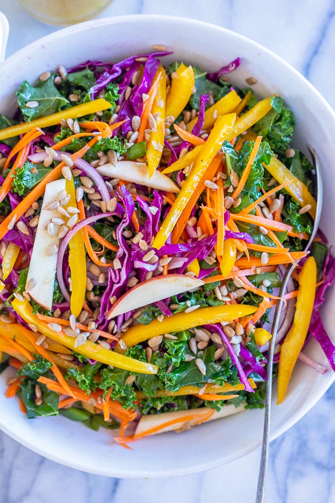 sunshine kale salad mixed together in a bowl