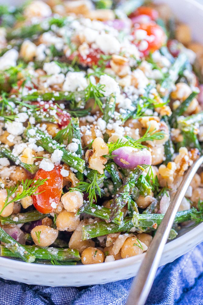 close up of roasted asparagus salad in a bowl