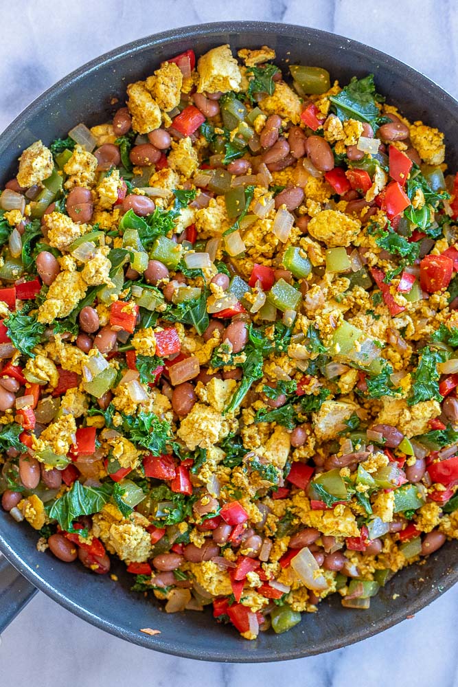 veggie filled tofu scramble with beans in a pan