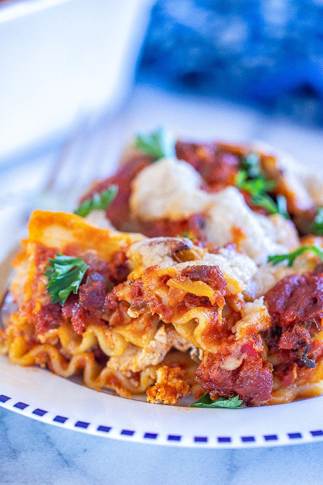 close up of a slice of vegan lasagna on a plate