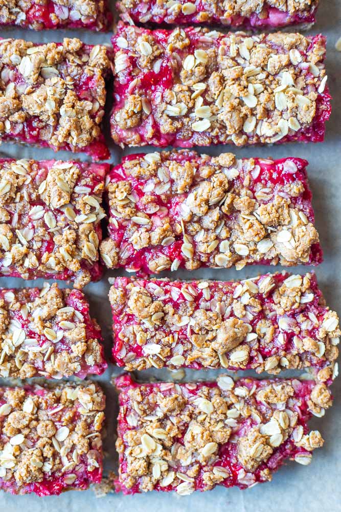 peanut butter and jelly bars on a baking sheet cup up