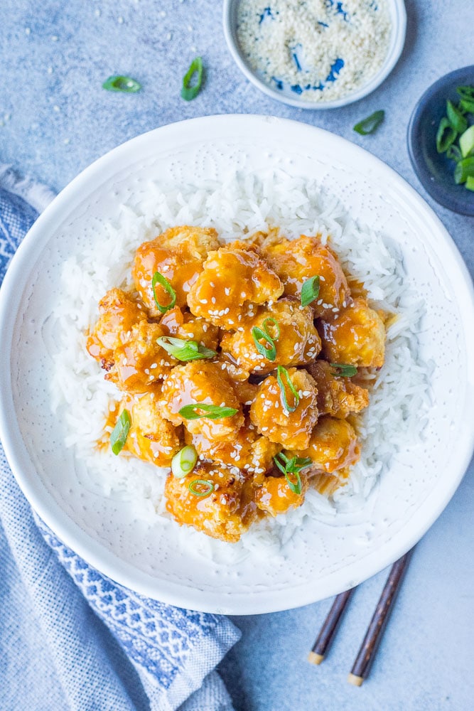 Vegan Orange Chicken in a bowl over rice